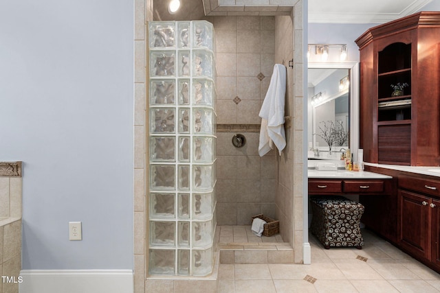 bathroom featuring tile patterned floors, ornamental molding, vanity, and a walk in shower