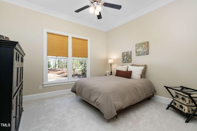 bedroom featuring ceiling fan, ornamental molding, baseboards, and light carpet