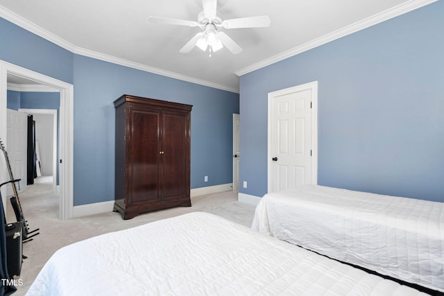 bedroom featuring crown molding, light colored carpet, and baseboards