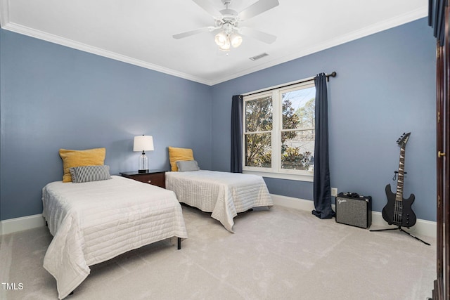 bedroom featuring visible vents, ornamental molding, carpet floors, baseboards, and ceiling fan