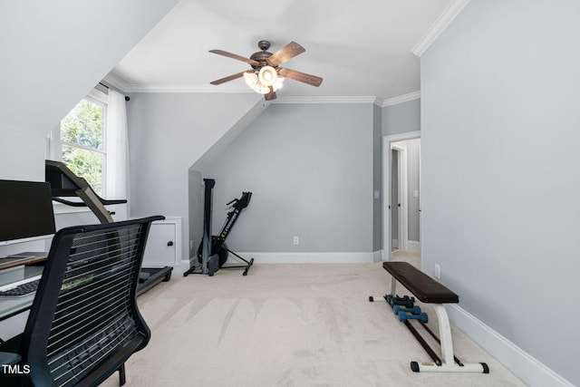 exercise room featuring carpet flooring, baseboards, crown molding, and a ceiling fan