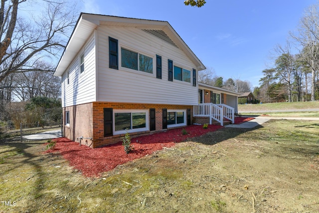 tri-level home with brick siding