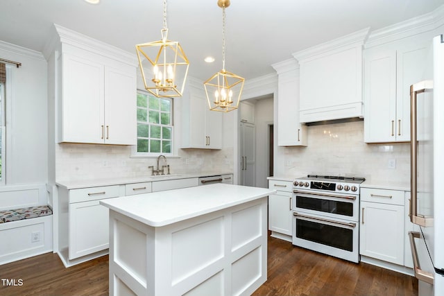 kitchen with white cabinetry, crown molding, and premium appliances