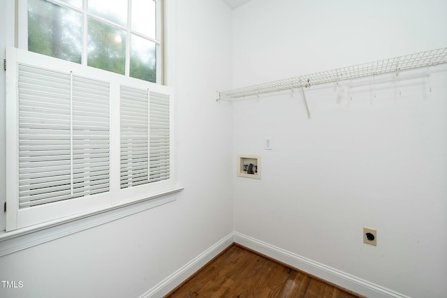 clothes washing area with baseboards, hookup for an electric dryer, laundry area, dark wood-style flooring, and washer hookup