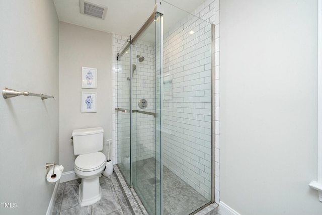 full bathroom featuring visible vents, toilet, and a shower stall