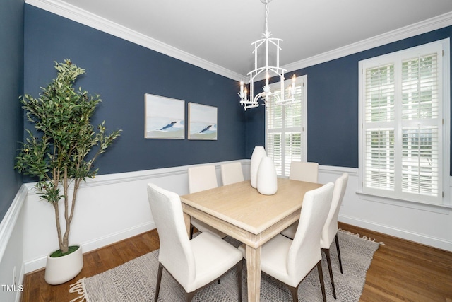 1222 Dixie Trl, Raleigh, NC 27607 - dining room with a chandelier, wood finished floors, crown molding, and wainscoting