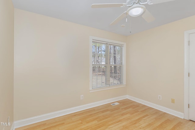 unfurnished room with visible vents, baseboards, ceiling fan, and light wood finished floors