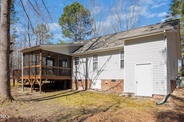 back of house with a lawn, a ceiling fan, a sunroom, a shingled roof, and crawl space