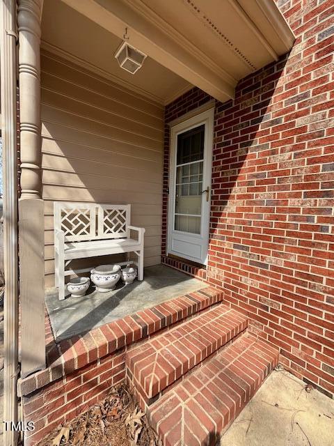 exterior space featuring brick siding