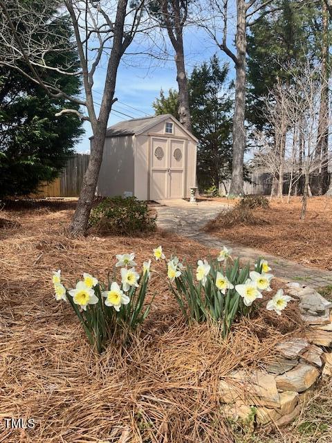 view of shed with fence