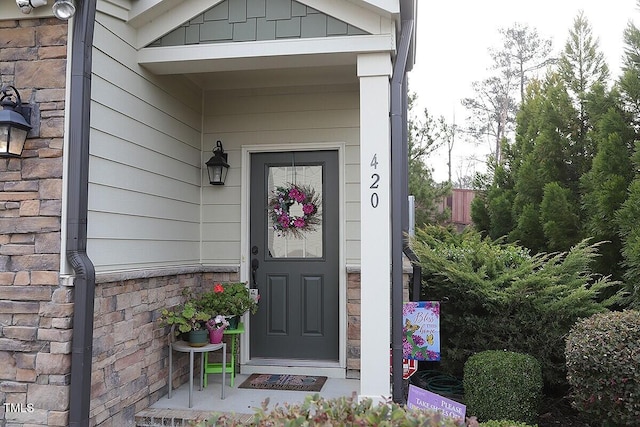 view of exterior entry with stone siding