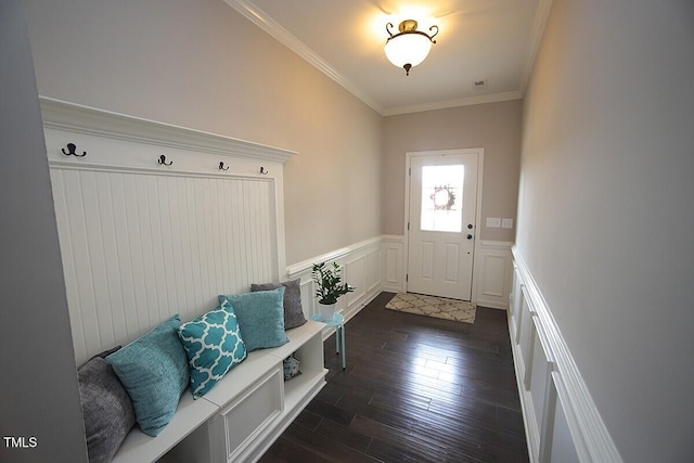 mudroom featuring dark wood-type flooring, a decorative wall, crown molding, and a wainscoted wall