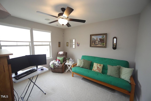 living room with carpet floors and ceiling fan