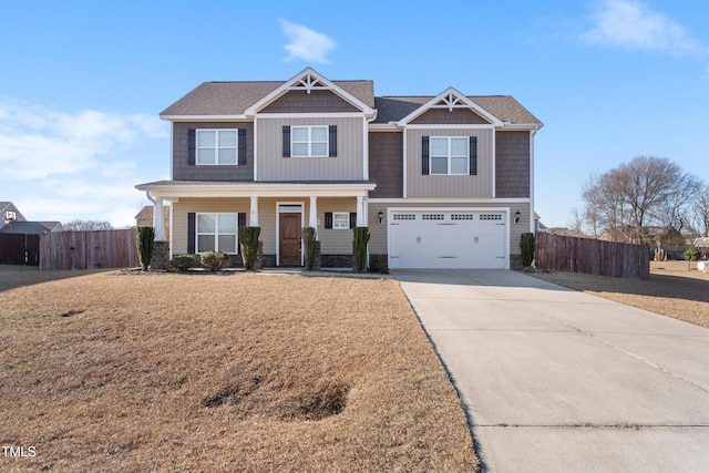 craftsman-style home featuring a porch, concrete driveway, a garage, and fence