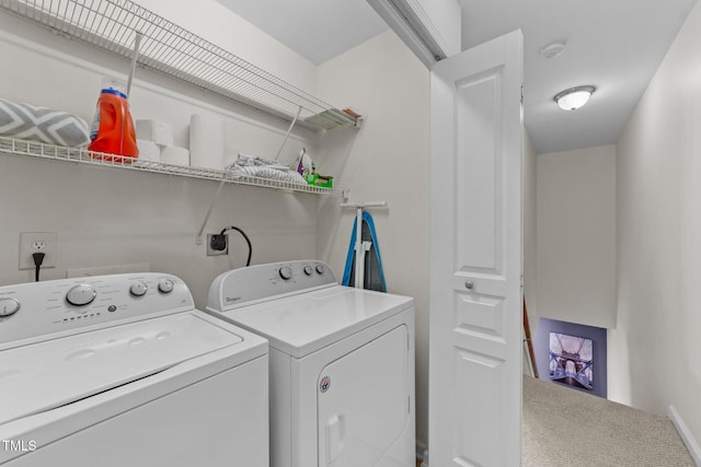 laundry area featuring washer and clothes dryer and laundry area