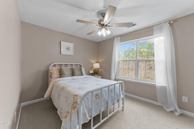 bedroom featuring visible vents, ceiling fan, baseboards, and carpet floors