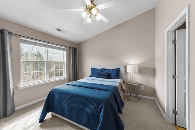 bedroom featuring visible vents, baseboards, carpet flooring, and vaulted ceiling