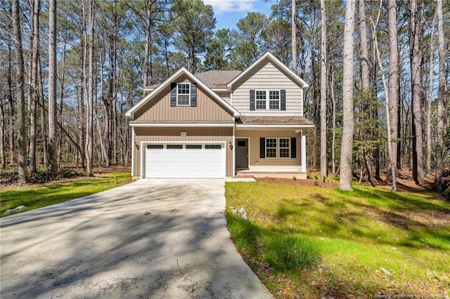 view of front of house featuring driveway, a forest view, roof with shingles, a front yard, and a garage