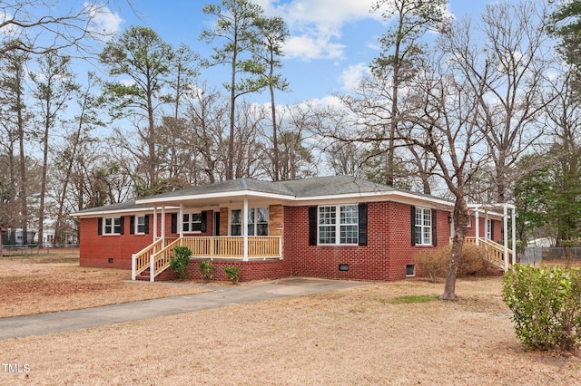 205 Woodside Dr, Goldsboro, NC 27534 - ranch-style house featuring a porch, brick siding, driveway, and crawl space