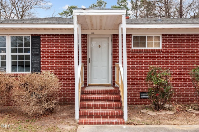 205 Woodside Dr, Goldsboro, NC 27534 - doorway to property with a shingled roof, brick siding, and crawl space