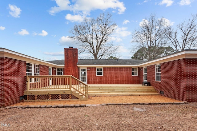 205 Woodside Dr, Goldsboro, NC 27534 - back of house with a wooden deck, brick siding, and a chimney