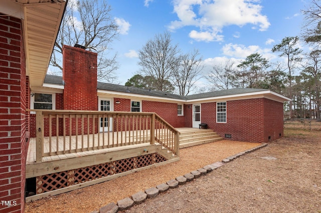 205 Woodside Dr, Goldsboro, NC 27534 - back of property featuring a deck, crawl space, brick siding, and a chimney