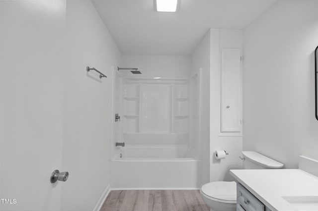 205 Woodside Dr, Goldsboro, NC 27534 - full bathroom featuring baseboards, toilet, shower / tub combination, wood finished floors, and vanity