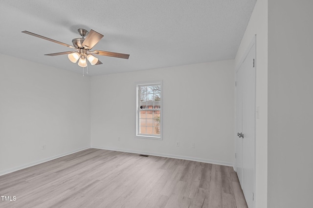 205 Woodside Dr, Goldsboro, NC 27534 - unfurnished room with visible vents, light wood-style floors, ceiling fan, and a textured ceiling