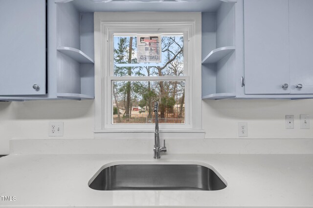 205 Woodside Dr, Goldsboro, NC 27534 - kitchen featuring open shelves, light countertops, and a sink