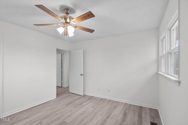 205 Woodside Dr, Goldsboro, NC 27534 - empty room with visible vents, light wood-style flooring, baseboards, and ceiling fan