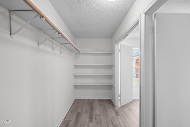 205 Woodside Dr, Goldsboro, NC 27534 - spacious closet featuring wood finished floors