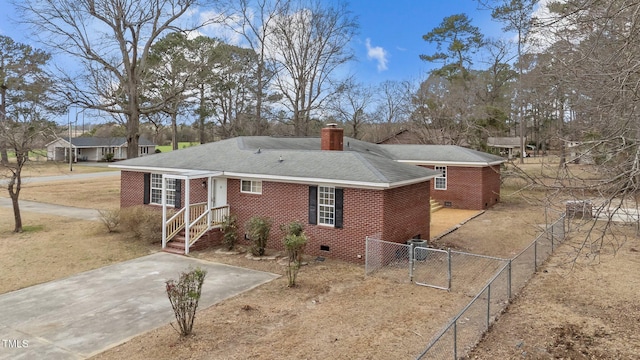 205 Woodside Dr, Goldsboro, NC 27534 - view of front of property featuring a gate, fence, brick siding, and a chimney