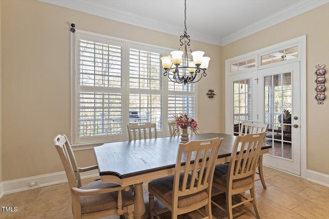 dining space featuring crown molding, a notable chandelier, baseboards, and light tile patterned floors