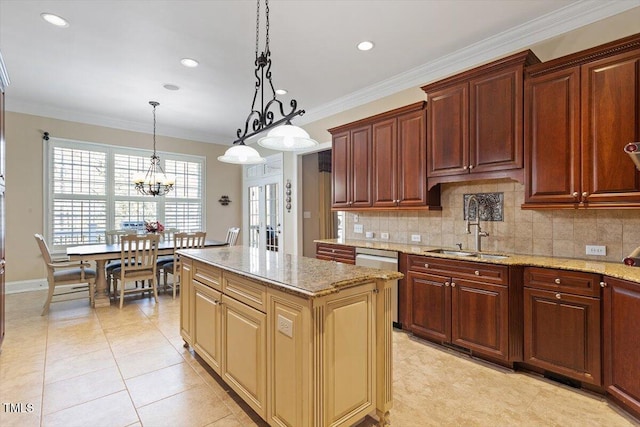 kitchen with a sink, decorative backsplash, light stone countertops, and crown molding