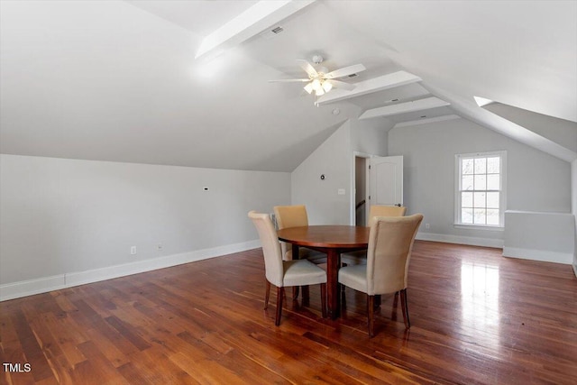 dining room featuring baseboards, lofted ceiling, and wood finished floors