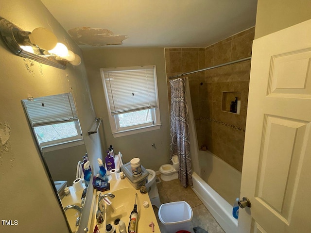 bathroom with tile patterned floors, shower / tub combo, and toilet