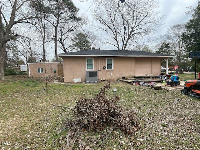 rear view of house with cooling unit