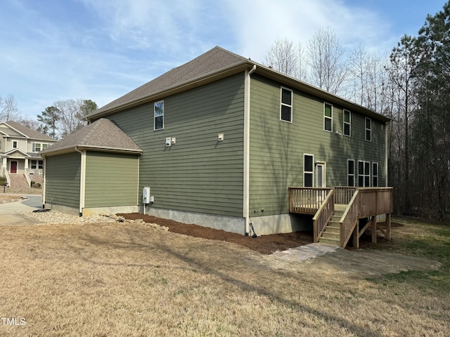 back of house featuring a wooden deck