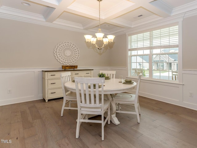 dining area with visible vents, beamed ceiling, light wood-type flooring, and an inviting chandelier