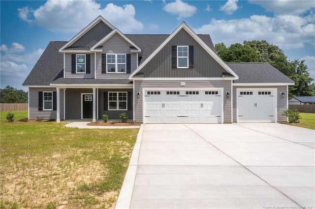 5815 James Allen Ln, Stedman, NC 28391 - craftsman house with driveway, an attached garage, board and batten siding, covered porch, and a shingled roof