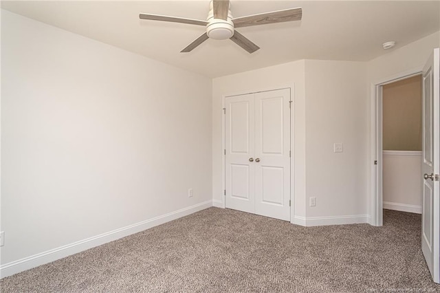 5815 James Allen Ln, Stedman, NC 28391 - unfurnished bedroom with carpet, a closet, baseboards, and ceiling fan