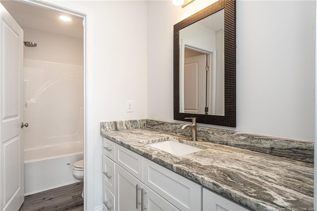 5815 James Allen Ln, Stedman, NC 28391 - full bathroom with vanity, toilet, wood finished floors, and  shower combination