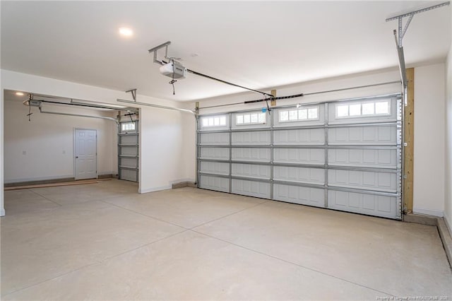 5815 James Allen Ln, Stedman, NC 28391 - garage with a garage door opener and baseboards