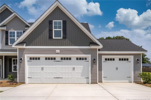 5815 James Allen Ln, Stedman, NC 28391 - view of front of property with concrete driveway, board and batten siding, and an attached garage