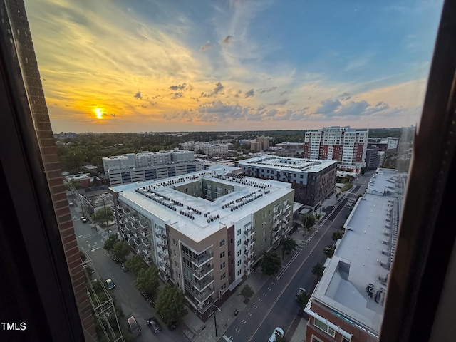 birds eye view of property with a view of city