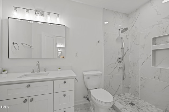 bathroom featuring a marble finish shower, marble finish floor, toilet, and vanity