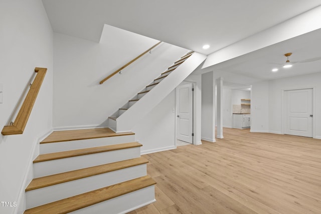 stairs featuring recessed lighting, baseboards, and wood finished floors