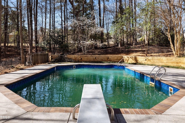 pool featuring a diving board