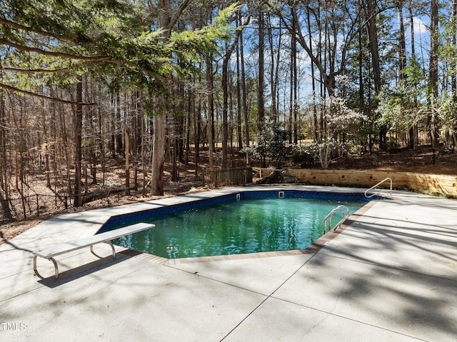 pool with a patio area