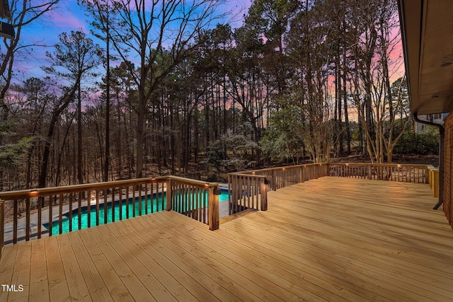 wooden terrace with an outdoor pool